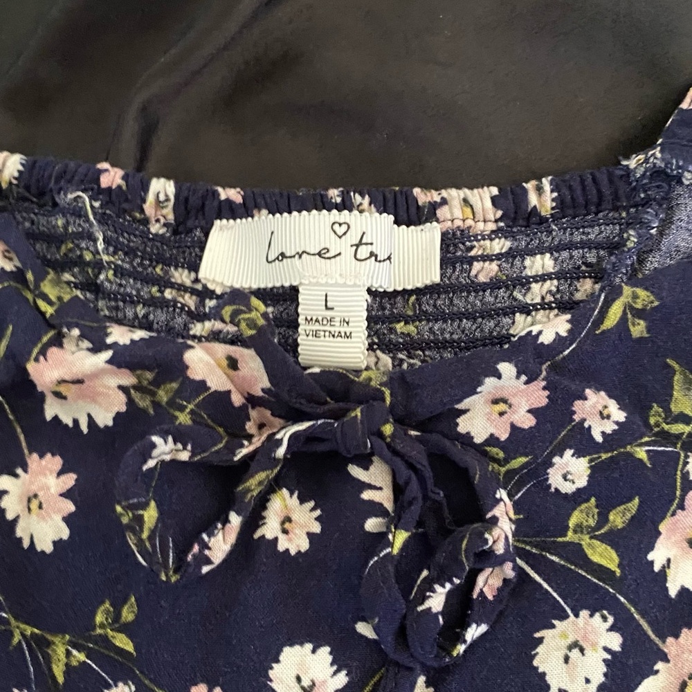 This is an off the shoulders top. It is very cute and festive.
